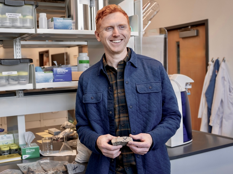 Glacial geology and paleoclimatologist Aaron Barth works with rock samples in the laboratory.