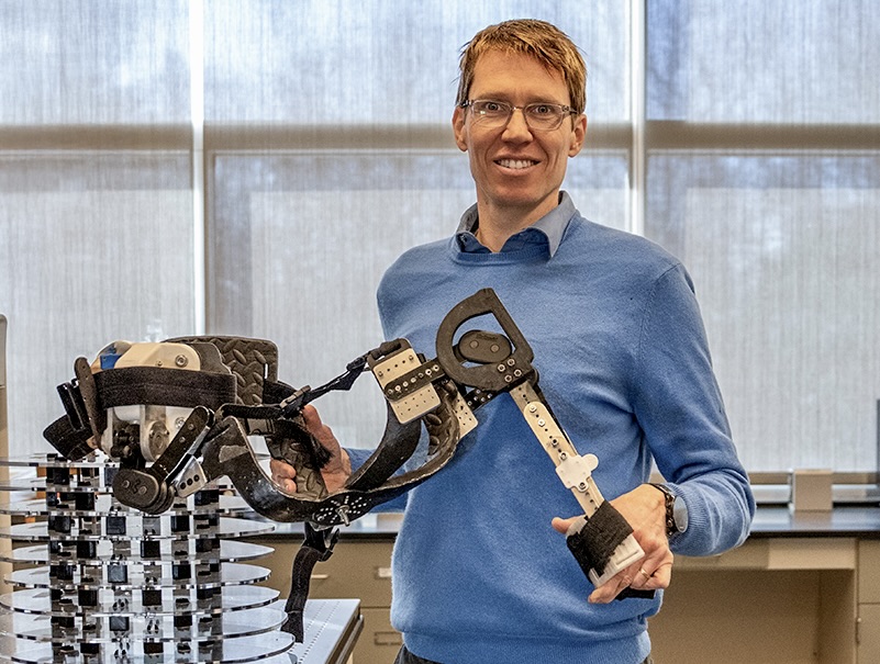 Mitja Trkov demonstrates a wearable robotic prototype.