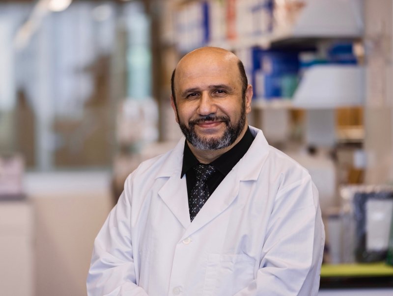 Dr. Omar Tliba working in his lab
